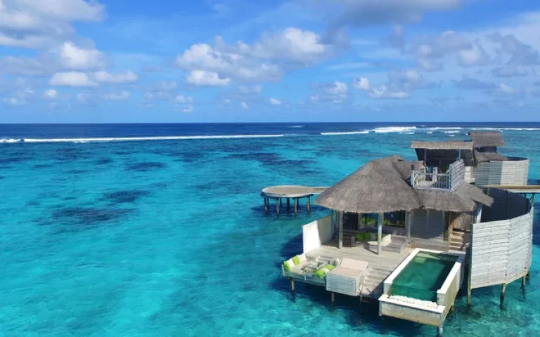 Aerial view of the water villas with pools at Six Senses Laamu, Laamu Atoll, Maldives
