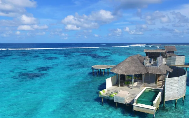 Six Senses Laamu water villas aerial view — luxury conservation dive resort, only resort in Laamu Atoll
