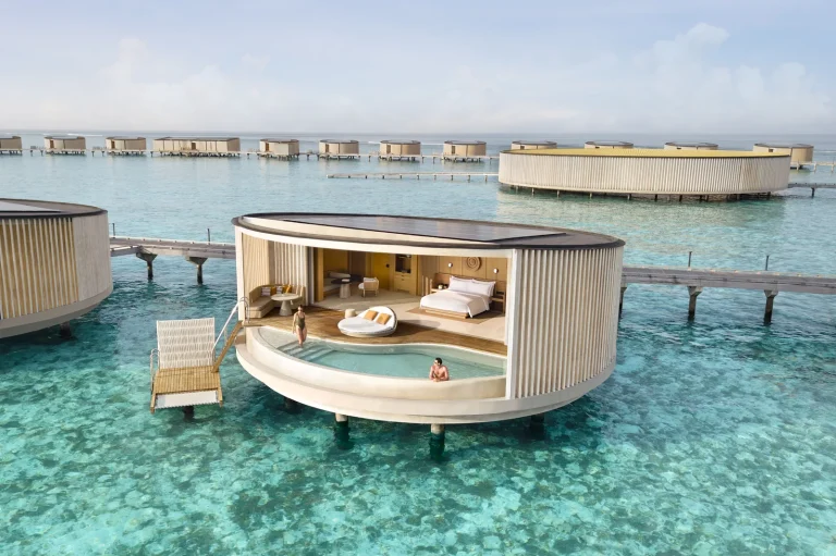 Circular overwater Lagoon Pool Villa with a curved infinity pool and steps into the lagoon at The Ritz-Carlton Maldives, Fari Islands, North MalΓ© Atoll