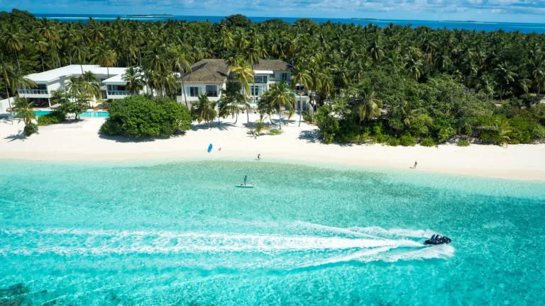 Aerial view of the beach residences and lagoon at Amilla Maldives Resort and Residences, Baa Atoll