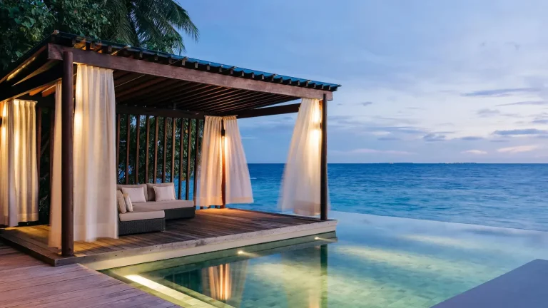 Beach pool villa with an infinity plunge pool and curtained sala facing the ocean at Park Hyatt Maldives Hadahaa, Gaafu Alifu Atoll