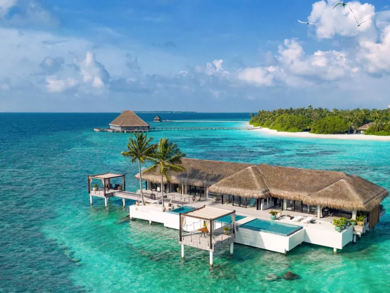 Aerial view of the boat-access Romantic Pool Residence standing alone in the lagoon at Velaa Private Island, Noonu Atoll, Maldives