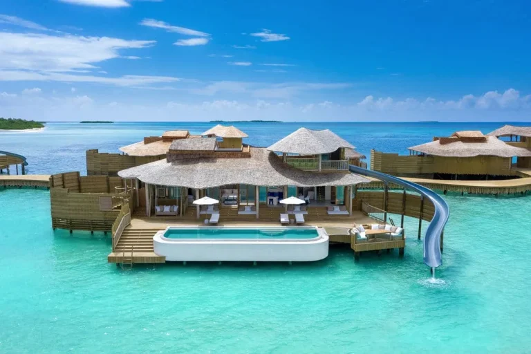 Soneva Jani overwater villa with a private pool, sun deck and a curved water slide dropping into the lagoon, Noonu Atoll, Maldives