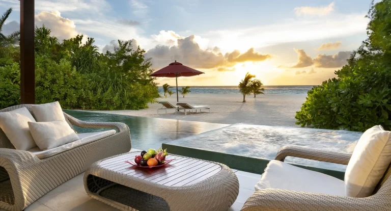 Beach pool pavilion with a large private infinity pool and loungers facing the lagoon at Niyama Private Islands, Dhaalu Atoll, Maldives