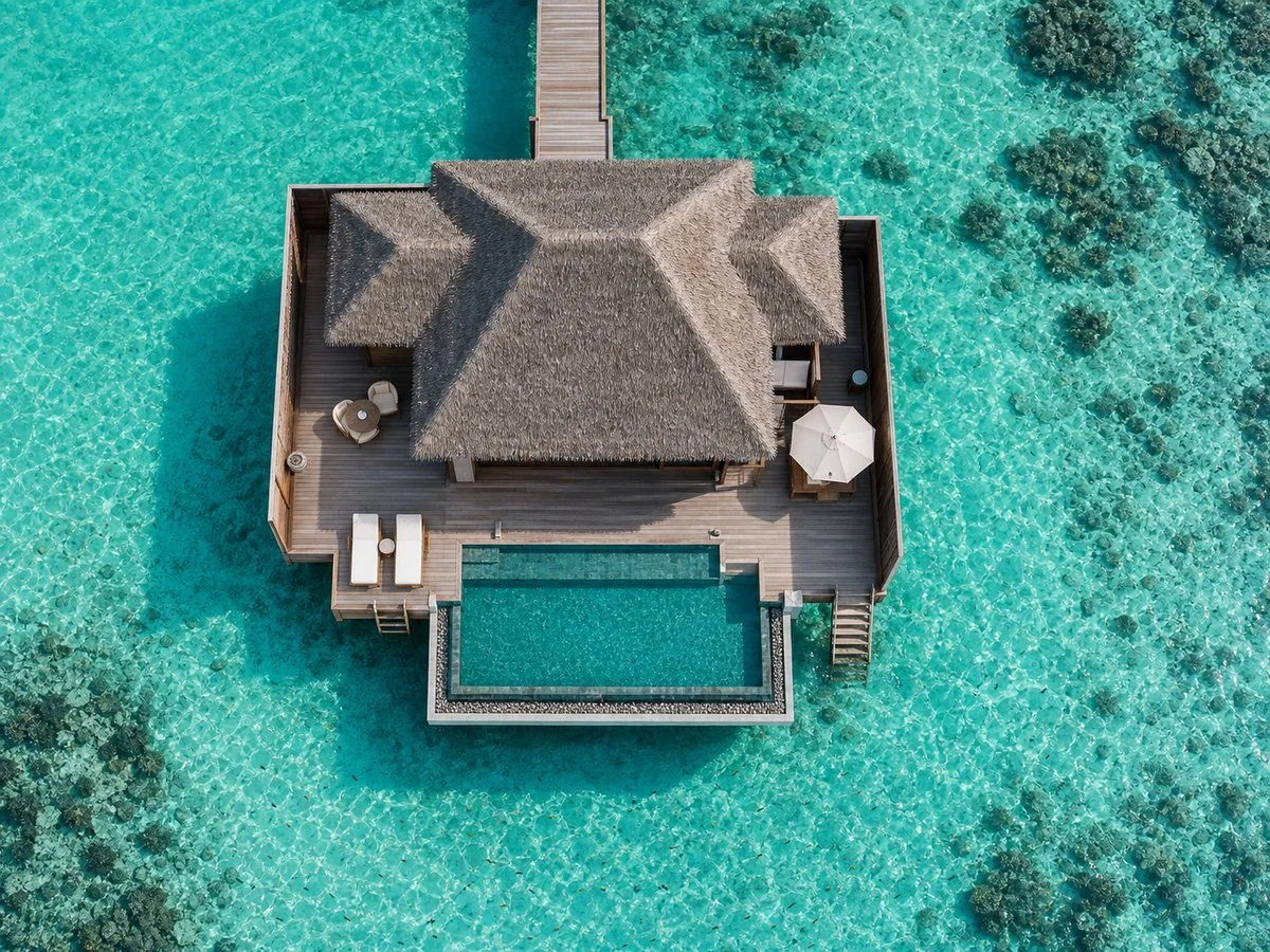 Maldives luxury overwater villa with private pool Aerial view of a maldives overwater villa with private pool