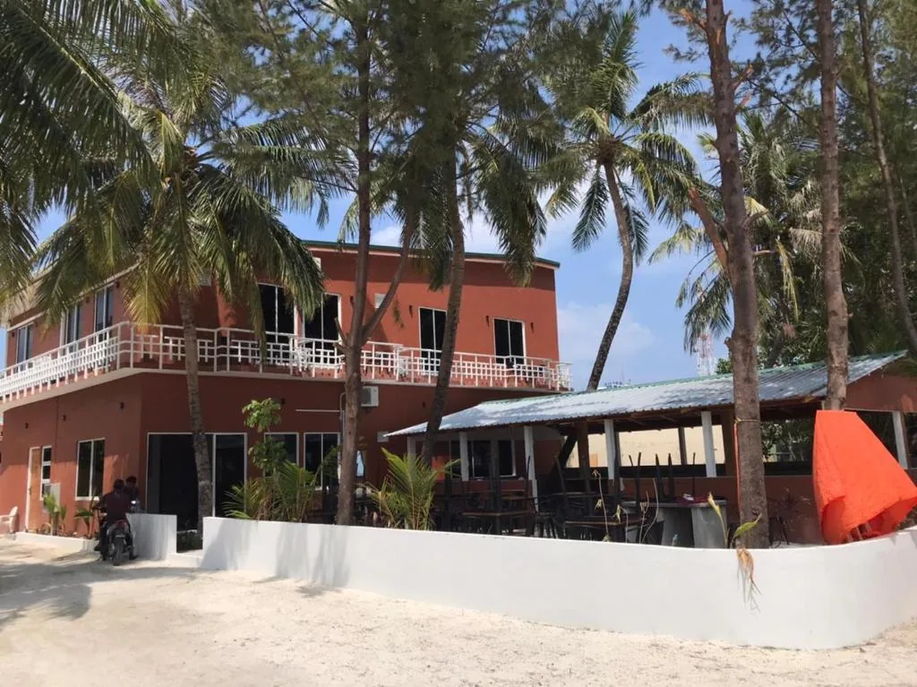 Merijaan Maldives beachfront with balcony and palm-lined veranda, Maafushi, Maldives