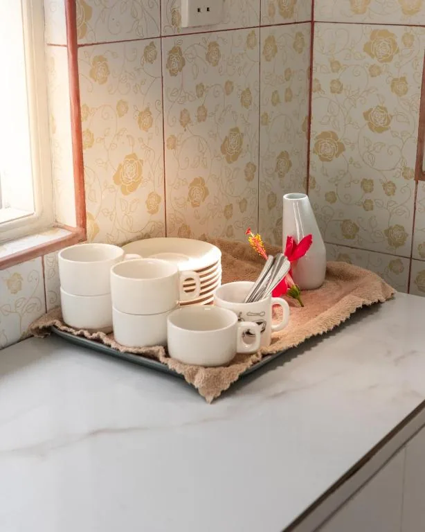 Tray with cups and mugs on a counter at Moro Fuvahmulah, Fuvahmulah, Maldives