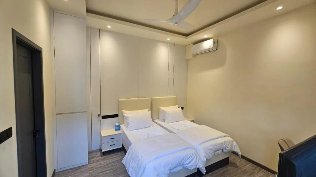 Bedroom with a bed with white sheets and pillows at Oceara Dharavandhoo, Dharavandhoo, Maldives