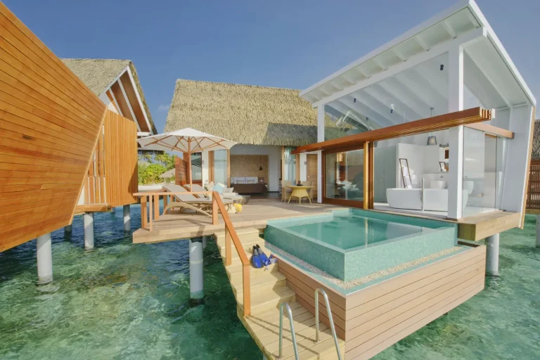 Ocean Pool Villa with a glass-sided private pool, deck and steps down to clear reef water at Kandolhu Maldives, North Ari Atoll